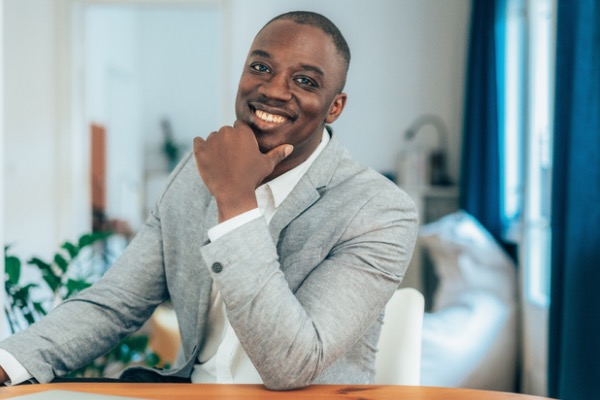 Man smiling in a suit